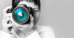 Woman photographer with camera